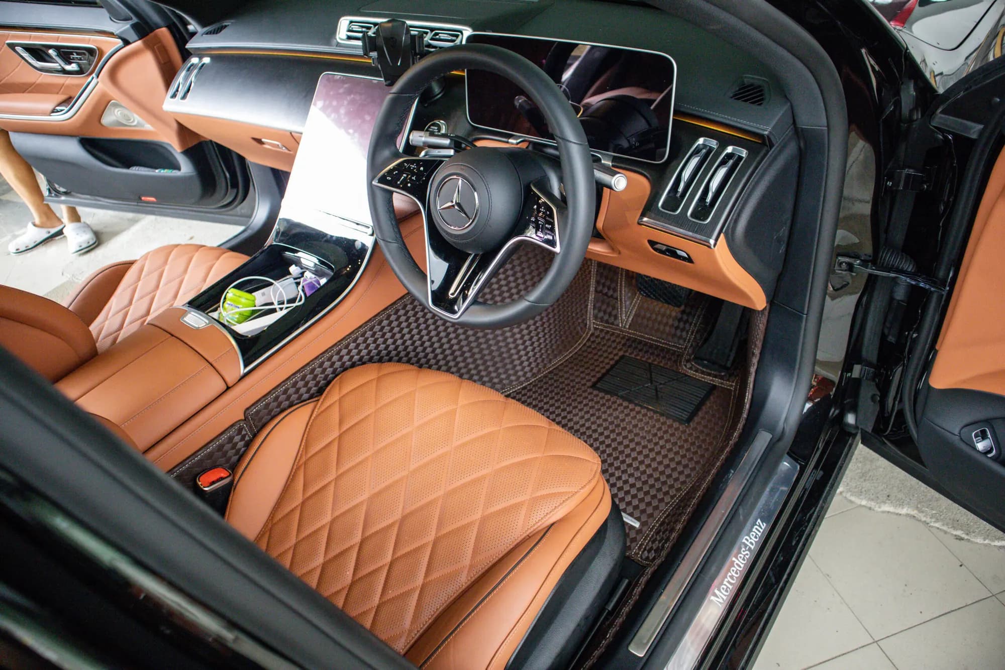 Mercedes S-Class driver's footwell with a brown 3D car mat