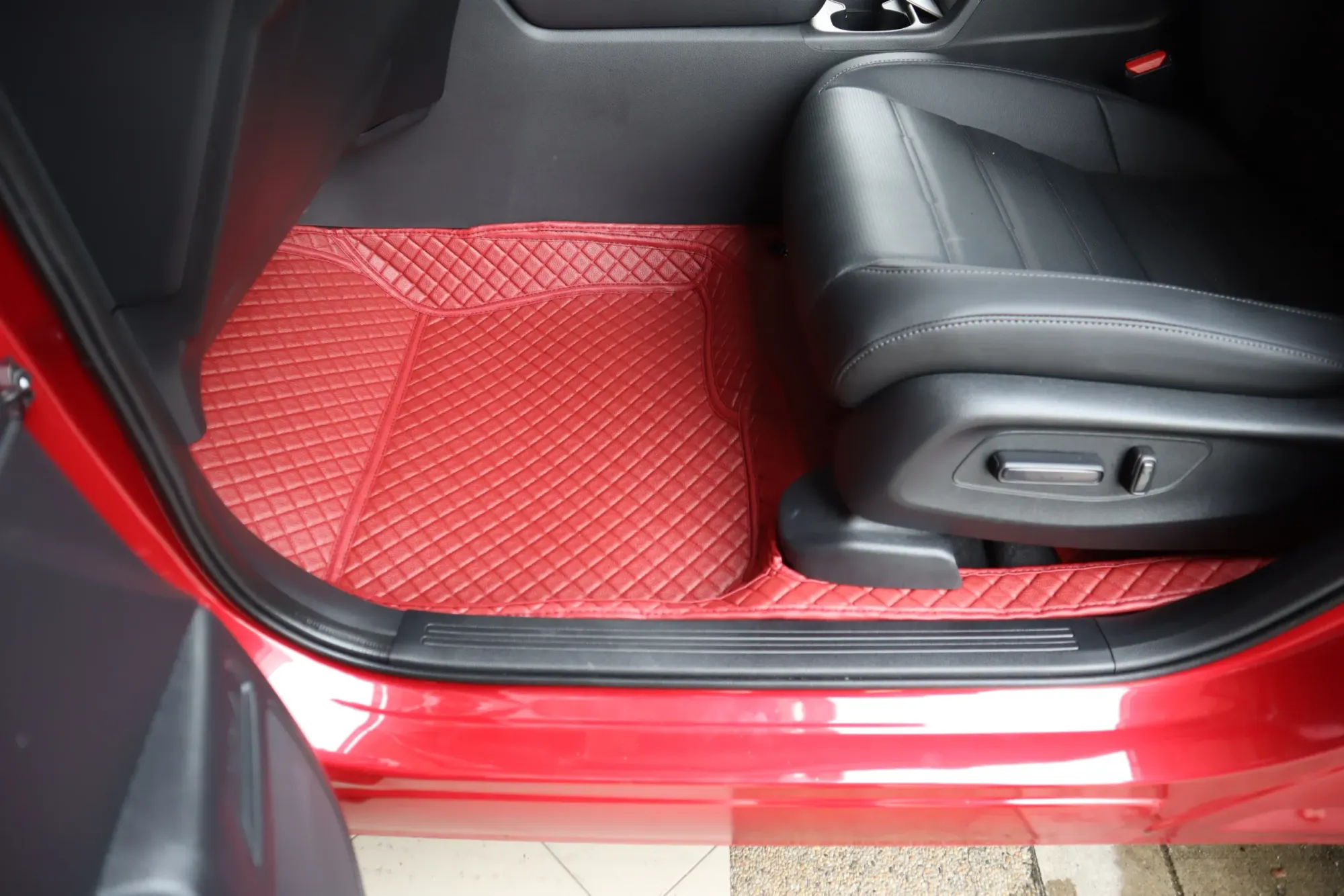 Red SUV front footwell seen from the door, red 3D car mat