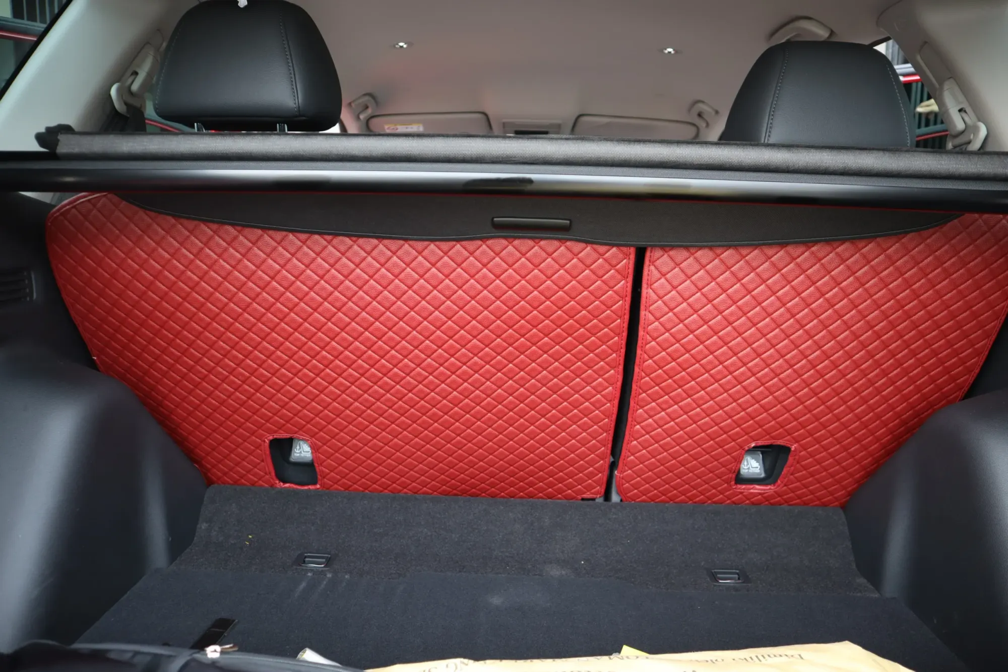 Red SUV boot and seat backs covered in red 3D mats