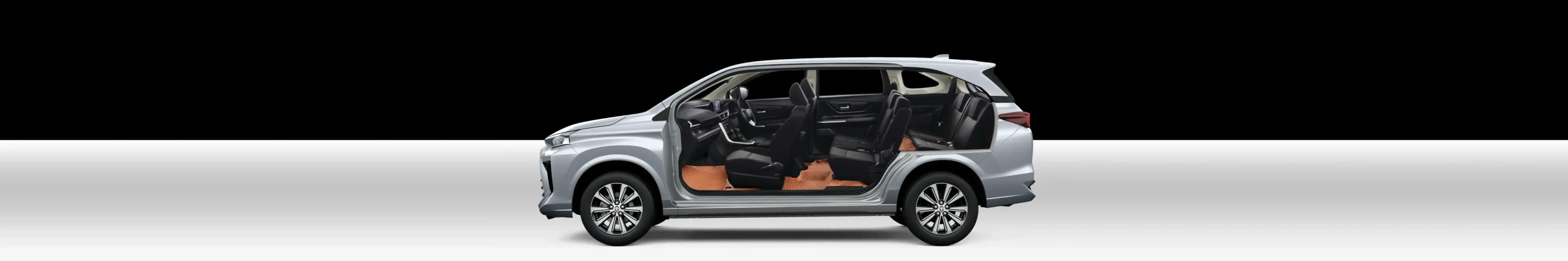 Cut-away of a silver seven-seater showing tan 3D car mats across all three rows
