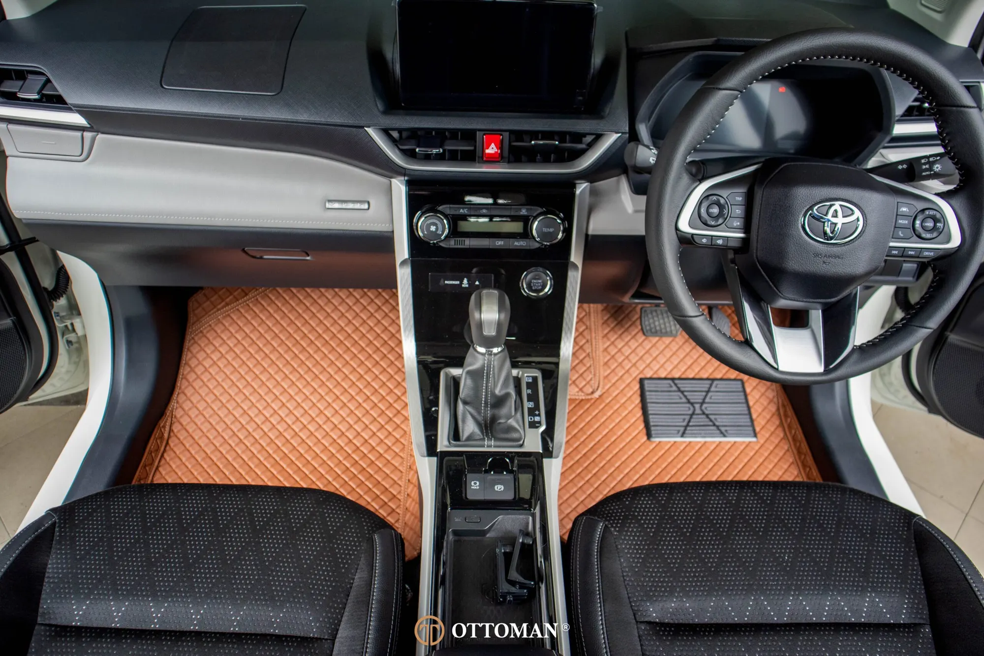 Front row of a seven-seater with tan 3D car mats