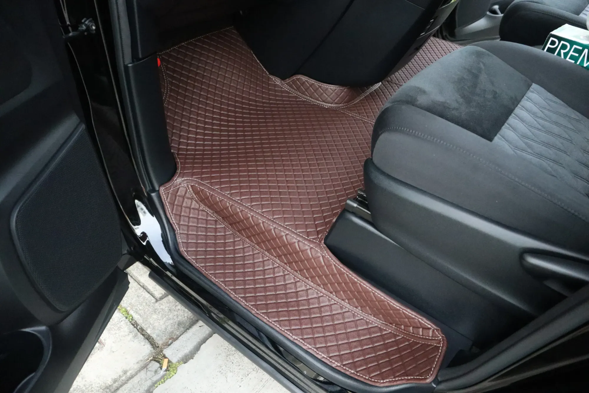 MPV side step with a brown 3D car mat