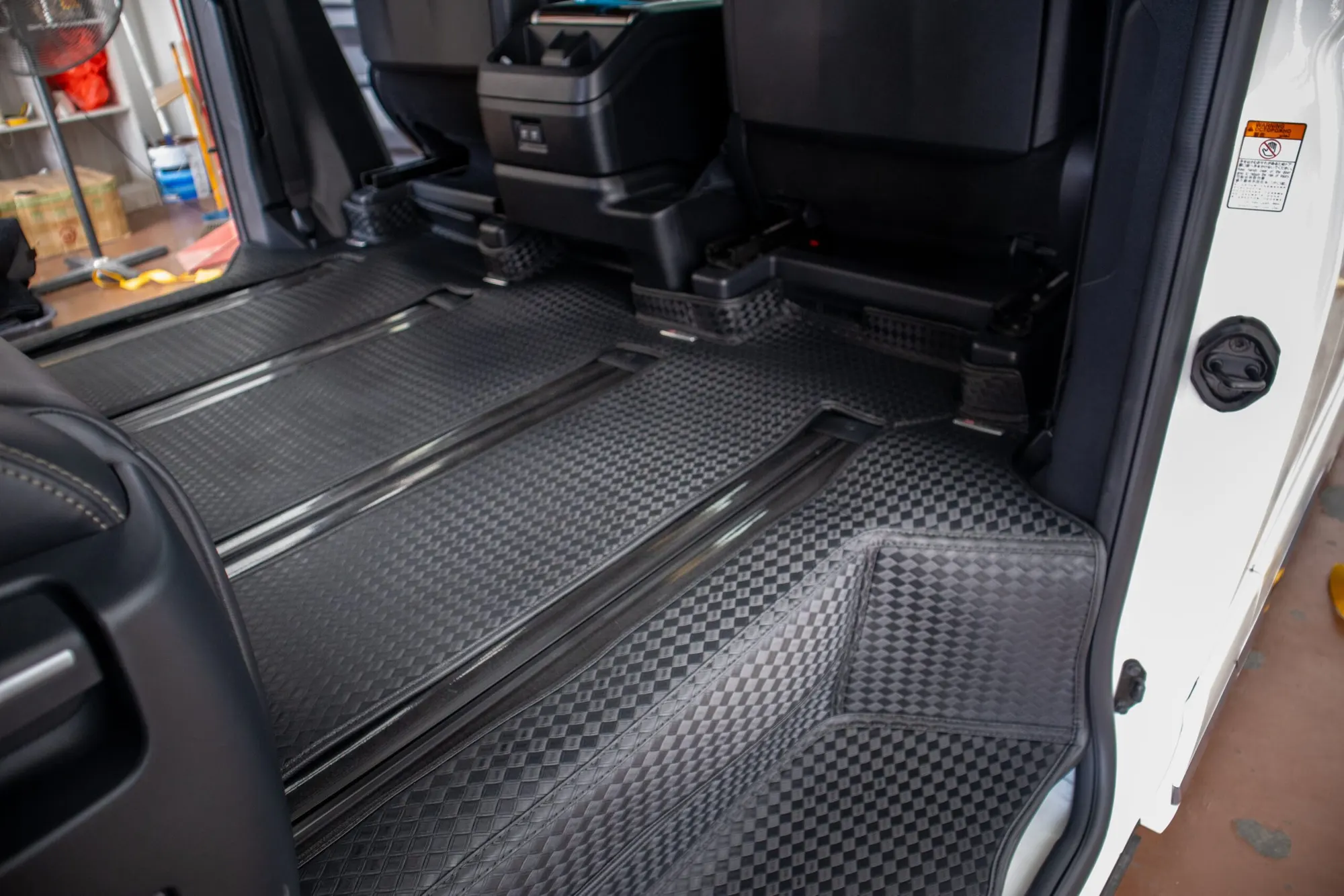 Large MPV walkway with black 3D car mats