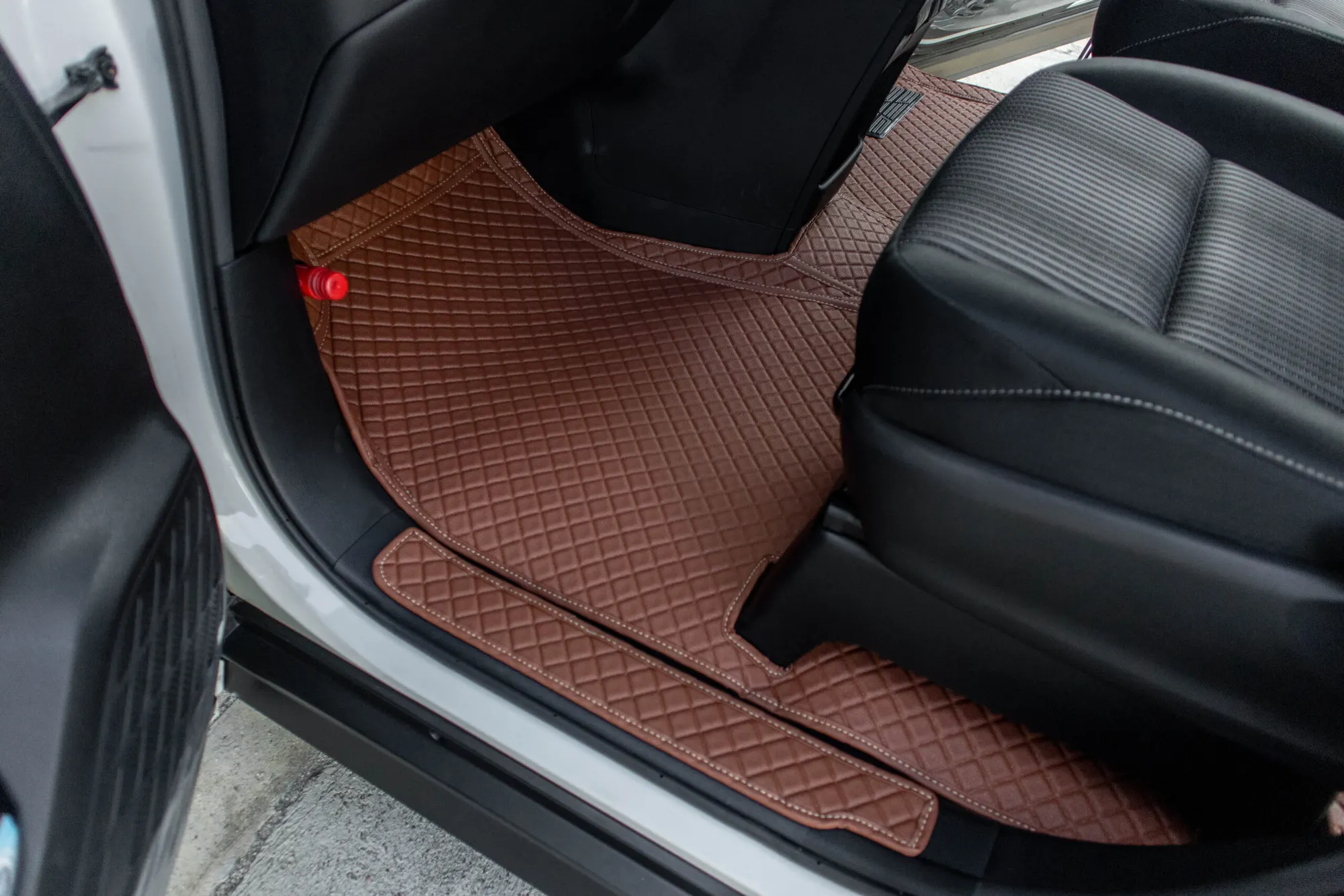 Small MPV side step with a brown 3D car mat