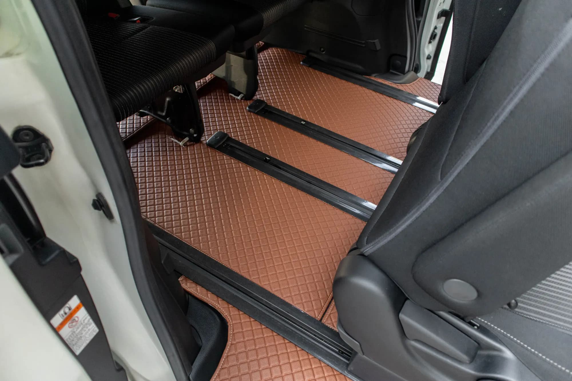 Small MPV rear floor with a brown 3D car mat