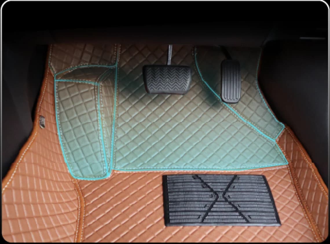 Driver footwell with the raised wall of a 3D mat outlined