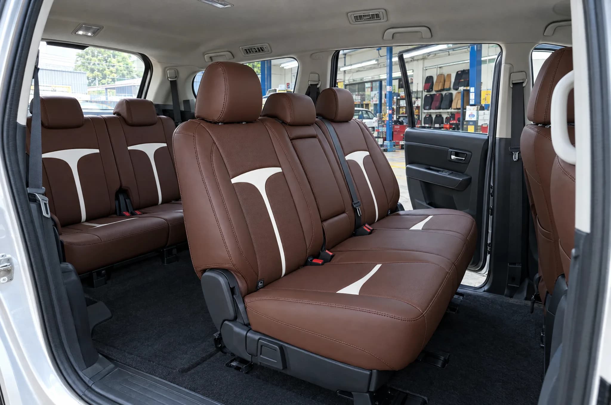 Render: second and third rows of a seven-seater with brown Titan seat covers